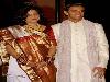 Cricketer Rahul Dravid poses along with his bride Vijeeta Pendharkar  after their marriage in Bangalore 04 May 2003. Dravid, vice captain of the Indian cricket team, got married to Pendharkar earlier in the day, according to Hindu rituals at a temple on the outskirts of the city, were attended by close friends and family members. They have two children: Samit, born in 2005, and Anvay, born in 2009.