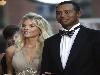 In November 2003, Woods became engaged to Elin Nordegren, a Swedish former model and daughter of former minister of migration Barbro Holmberg and radio journalist Thomas Nordegren. They were introduced during The Open Championship in 2001 by Swedish golfer Jesper Parnevik, who had employed her as an au pair. They married on October 5, 2004, at the Sandy Lane resort in Barbados, and lived at Isleworth, a community in Windermere, a suburb of Orlando, Florida. In 2006, they purchased a $39 million estate in Jupiter Island, Florida, and began constructing a 10,000-square-foot home; Woods moved there in 2010 following the couple's divorce, which was finalized August 23, 2010. Woods and Nordegren's first child, a daughter named Sam Alexis Woods, was born in 2007. Woods chose the name because his own father had always called him Sam. Their son, Charlie Axel Woods, was born in 2009.